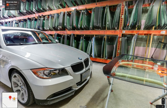 car waiting in the Wizard Auto Glass shop to have front windshield replace