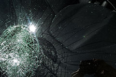 black car broken windshield evident for vandalism